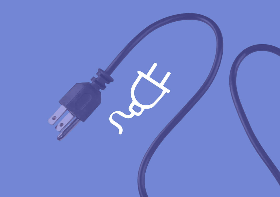 Black electrical plug and cord on a blue background.