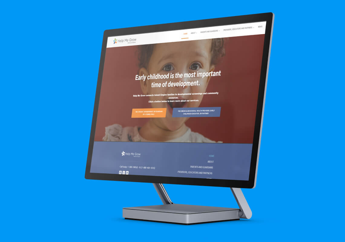 Computer monitor displaying the Help Me Grow website on early childhood development.