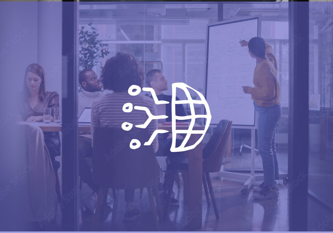 Team meeting with a presentation on a whiteboard in a modern office.