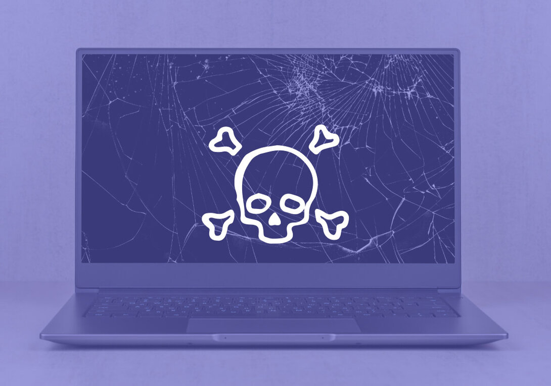 Laptop screen with skull and crossbones icon symbolizing digital danger.