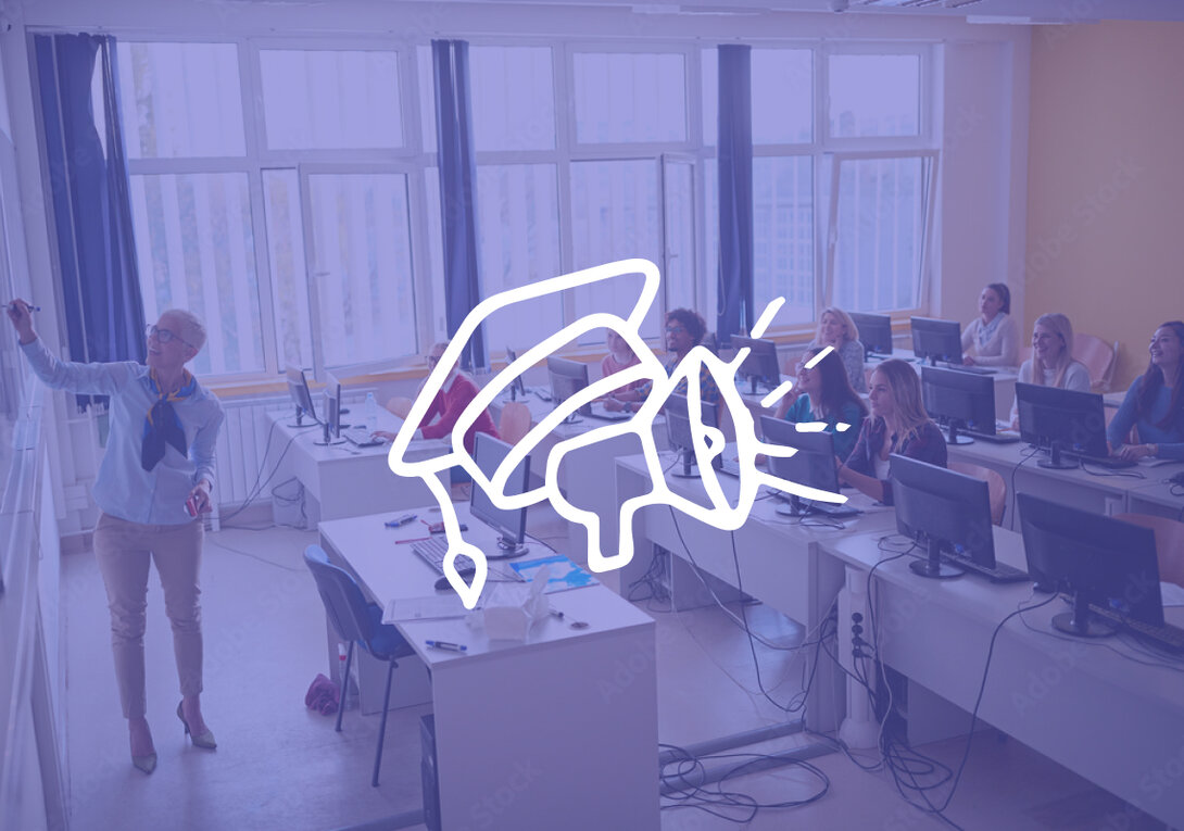 Teacher instructing students in computer lab with marketing overlay.