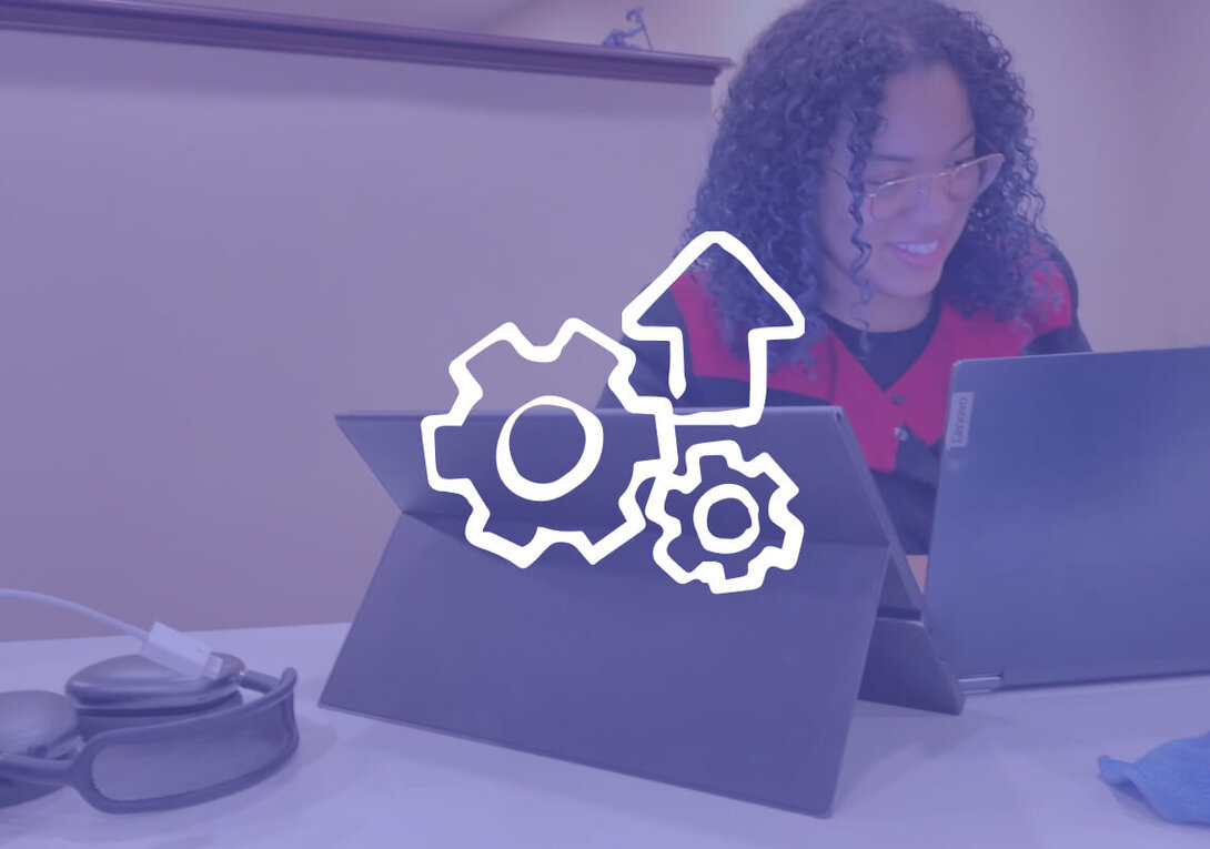 Woman working on tablet with technology icons overlay.