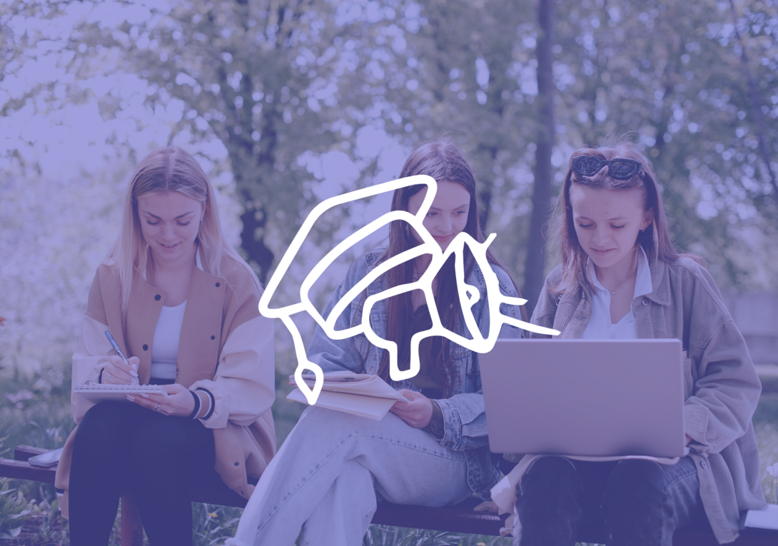 Three students studying outdoors with notebooks and laptop.