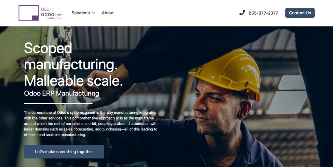 Worker in hard hat focuses on manufacturing equipment, showcasing Odoo ERP solutions.