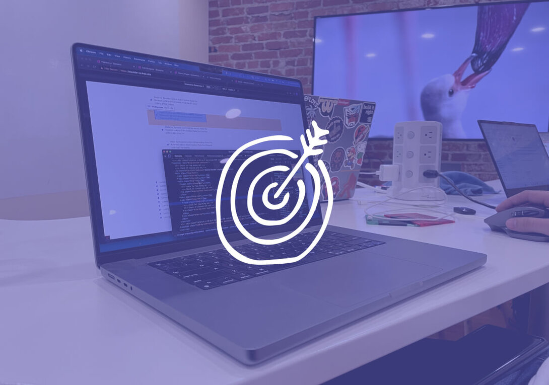 Laptop displaying code in a modern workspace with a target icon overlay.